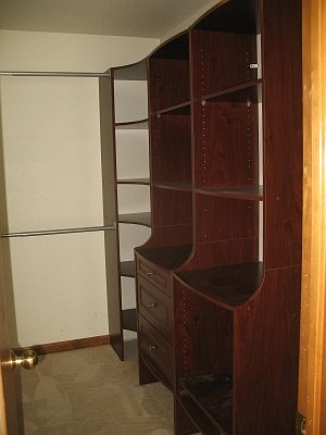 Master Walk in Closet with Custom Shelving