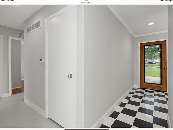 Front foyer and hallway leading to two bedrooms