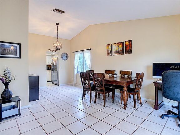 Looking from the foyer to the formal living and dining room which leads directly into the kitchen.