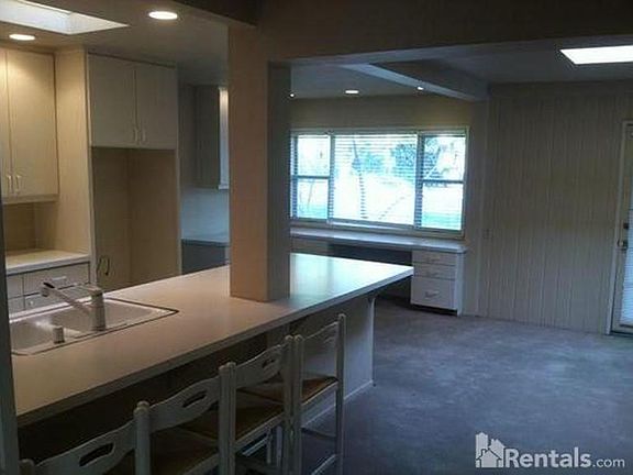 This is a roomy house with three bathrooms. And there_s a big bathtub the old kind that you could actually get wet in ..