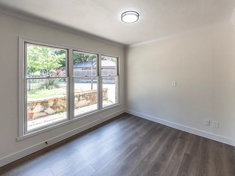 Formal dining room by the kitchen looking over pool/backyard.