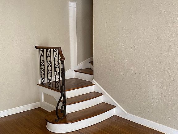 Living room stairs leading to second level.