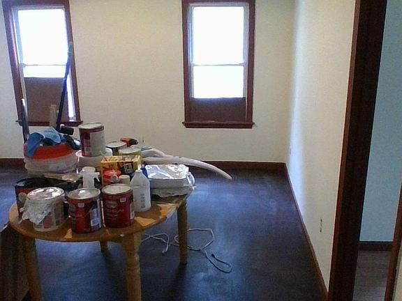 Entrance to common area/living room; 2 windows