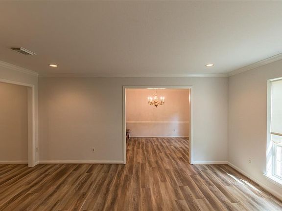 As you enter the home, living room and formal dining room