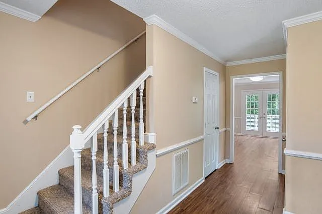 Look to your left and see the stairway to 2nd floor is on your left