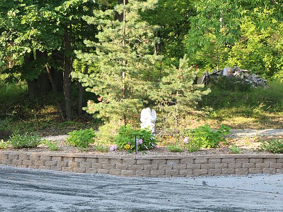 Upper garage beside driveway