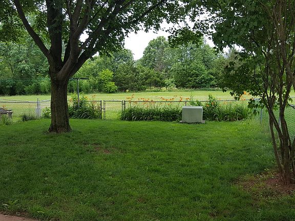 Fenced in backyard with access to open space.