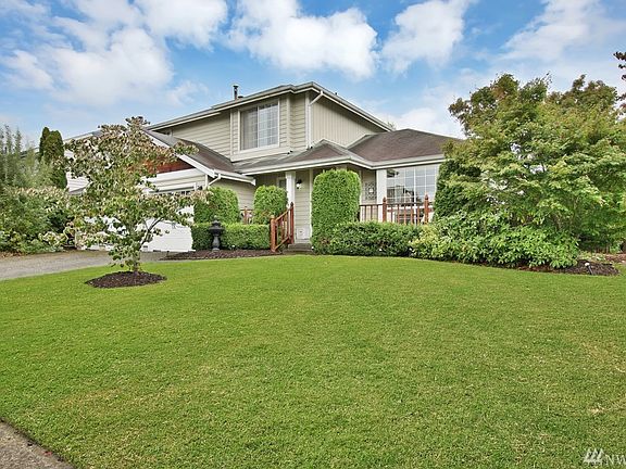 Well maintained yard with front porch and  so much curb appeal.