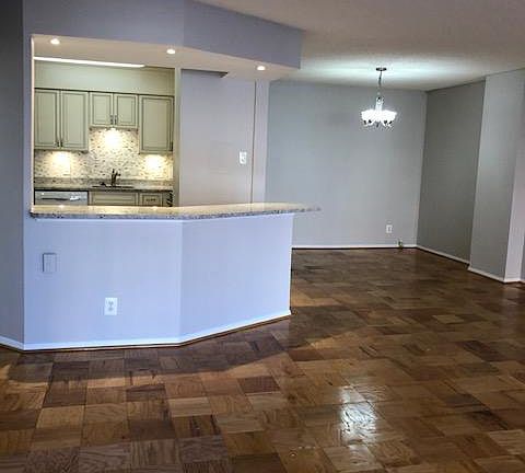 View from Living Room to Kitchen and separate Dining Room.