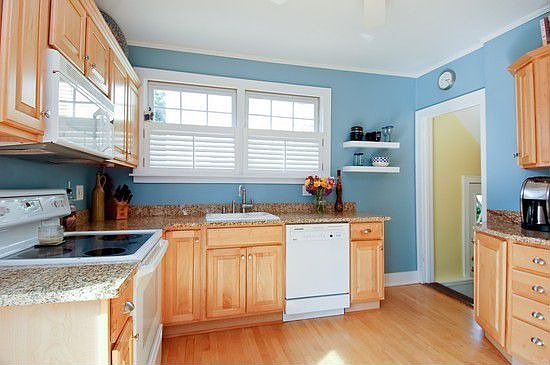Updated kitchen with maple cabinets, new granite and wood blinds