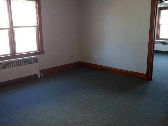 large living room with new carpet, freshly painted
