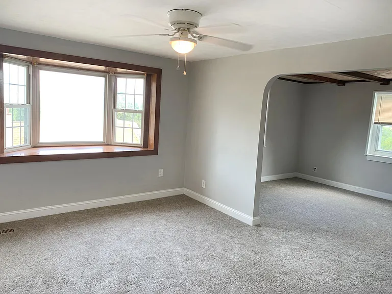 Large windows for a sunny living room and dining room.