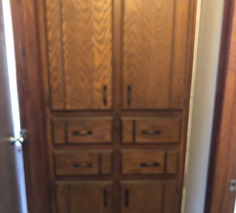Linen cabinet in hallway