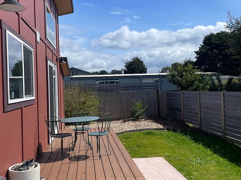 The south side of the home on a sunny day.