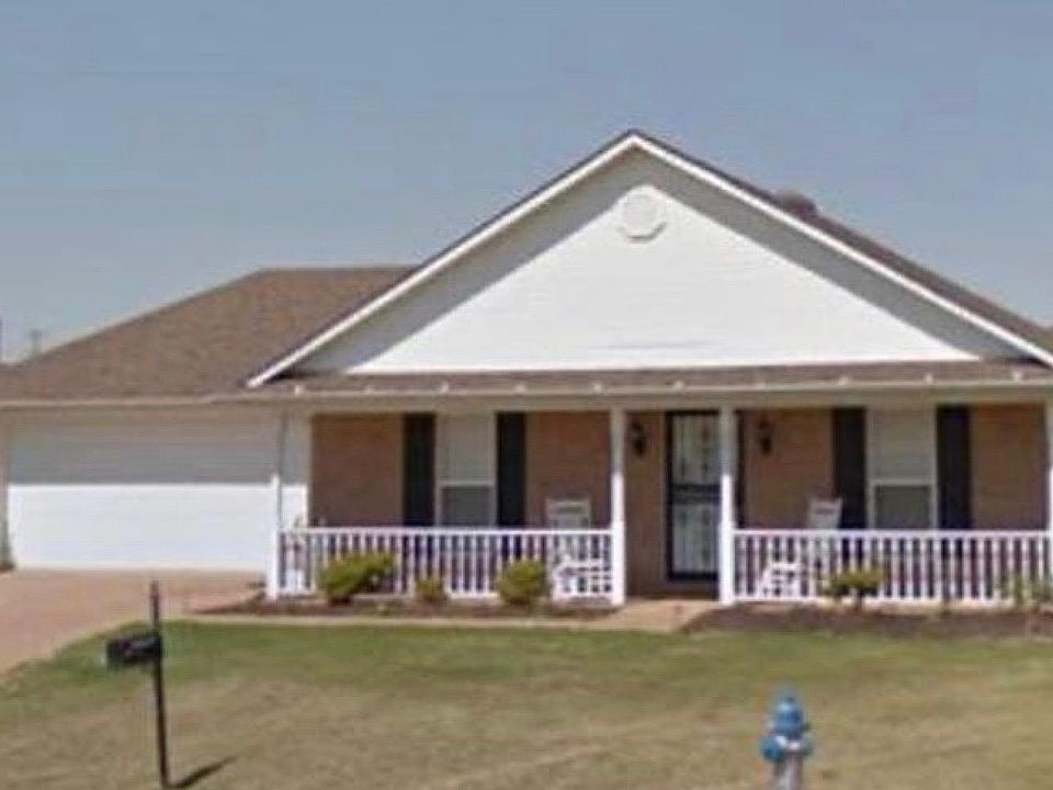 Front of home with porch and 2 car garage