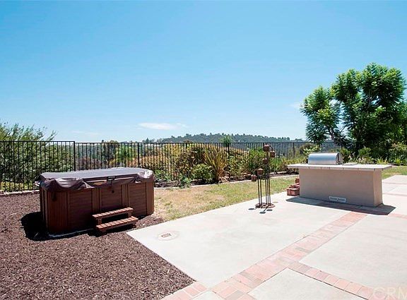 Rear yard with above ground spa and built-in BBQ
