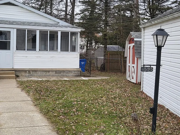 6x10 storage shed behind the garage