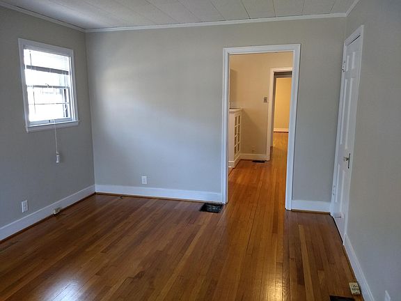 Newly refinished hardwood, new paint and blinds throughout 