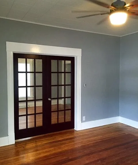 french doors to first bedroom from living room