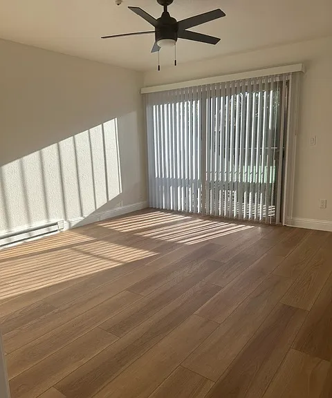 Bright natural afternoon light upstairs master bedroom with balcony
