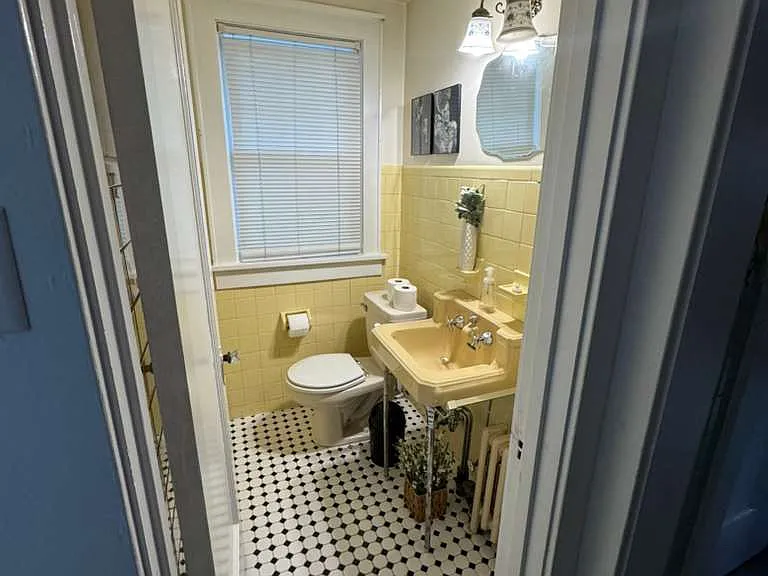 Powder Room off hall near kitchen