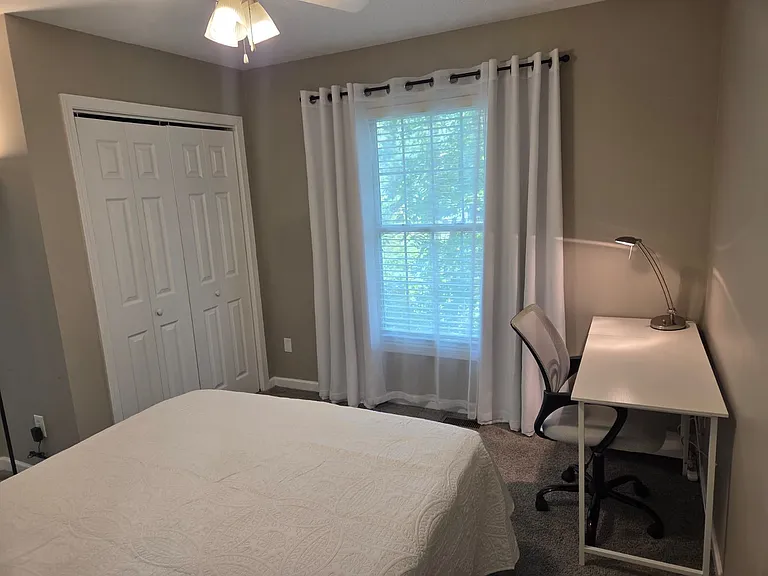 Comfortable queen bed with new mattress
Dedicated workspace with desk and chair
Large closet with ample storage
