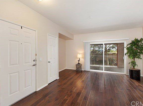 Living room with additional Media nook.  Opens to spacious balcony overlooking the greenbelt.