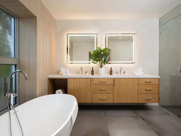 Primary bathroom comes equipped with a walk-in steam shower, Kohler Smart Toilet and large double sink for 2.