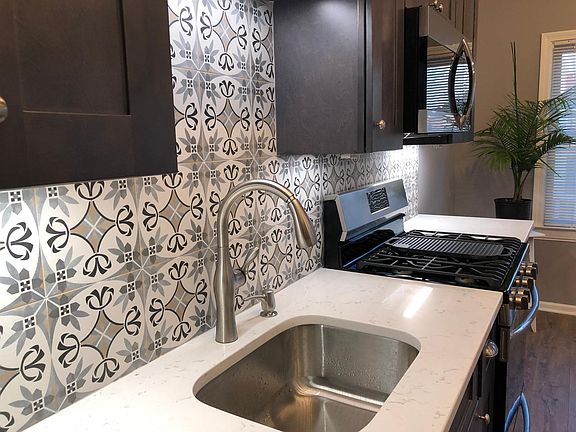 Brand New Kitchen with Stainless Steel Appliances and Quartz