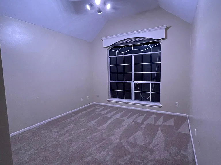 Bedroom 1 with vaulted ceiling