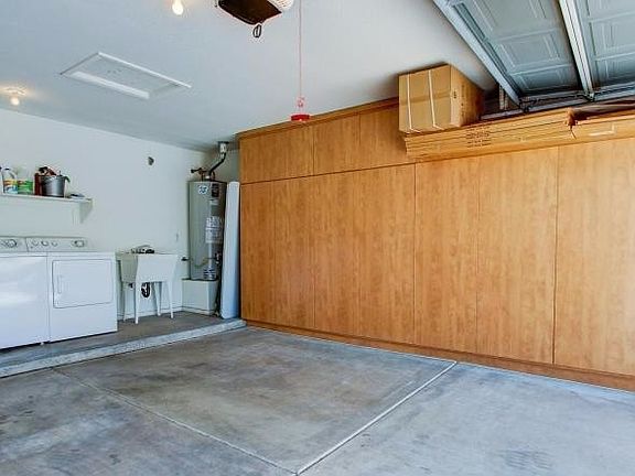 Garage with attached cabinets & washer & dryer