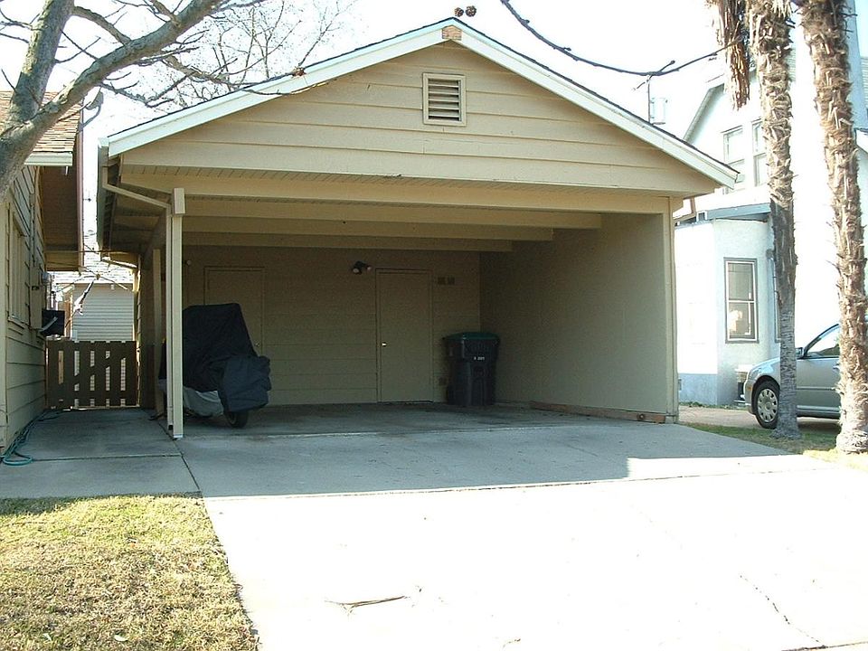 Carport with locking storage room