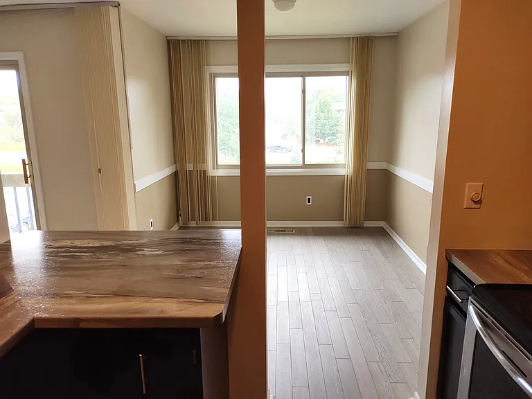 The kitchen adjoins the dining room