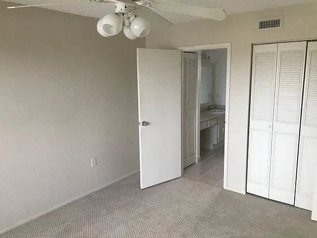 The other bedroom closet and door leading to the Bathroom and walk-in closet.