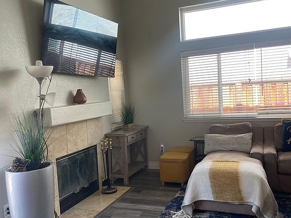 Family room with wood burning fire place.