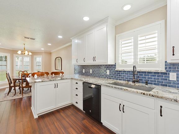 Kitchen with Oven Range, Microwave, Refrigerator/Freezer & Dishwasher