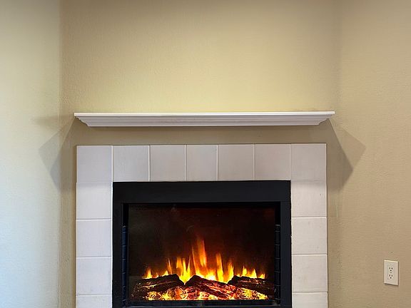 Staged Wood Burning Fireplace in Living Room