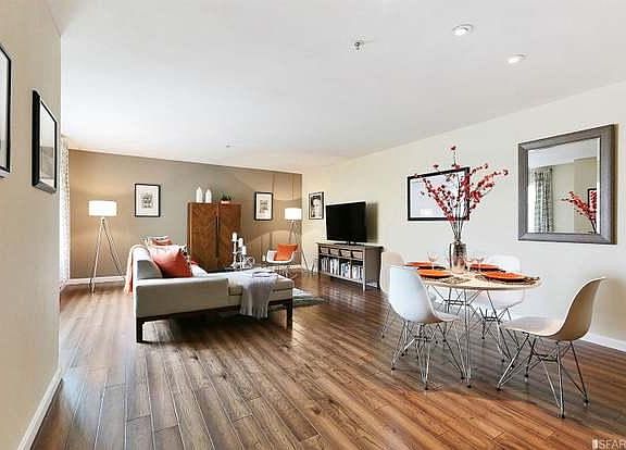 again, staged room, view from the main entry, bedroom behind the wall on the left side