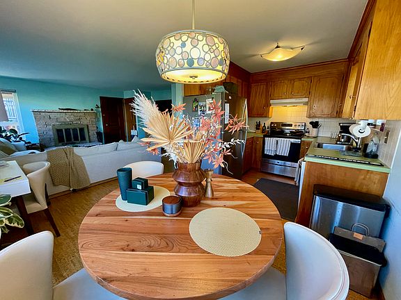 View to both living room and kitchen from dining area.