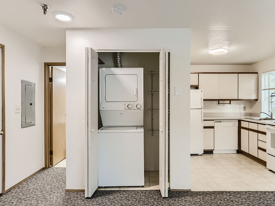 The stack washer/dryer is located in a closet. The kitchen is to the right.