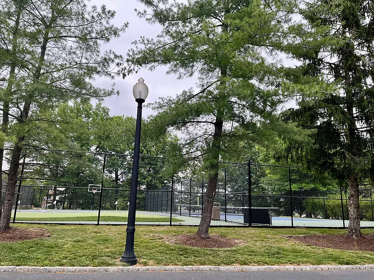 Basketball court, tennis and pickle ball court, putting green, playground