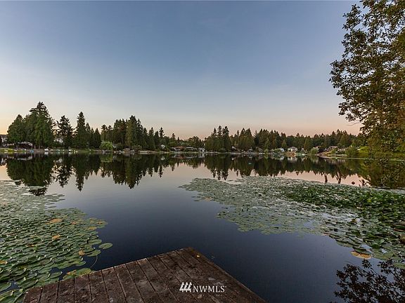 60 ft of waterfront with dock on Shady Lake - 21 acres of clear water lake - perfect for swimming, boating or fishing in the trout-stocked waters