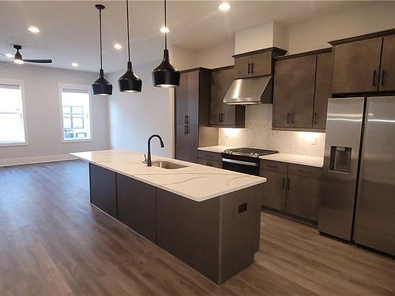 brand new upgraded appliances, quartz counters, gas range cooktop, oven also has convection and air fryer features. Range vent does filter outside.