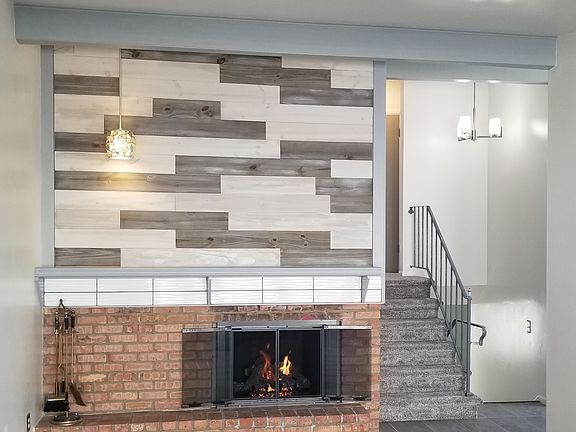 Main living area, staircase with chandelier.