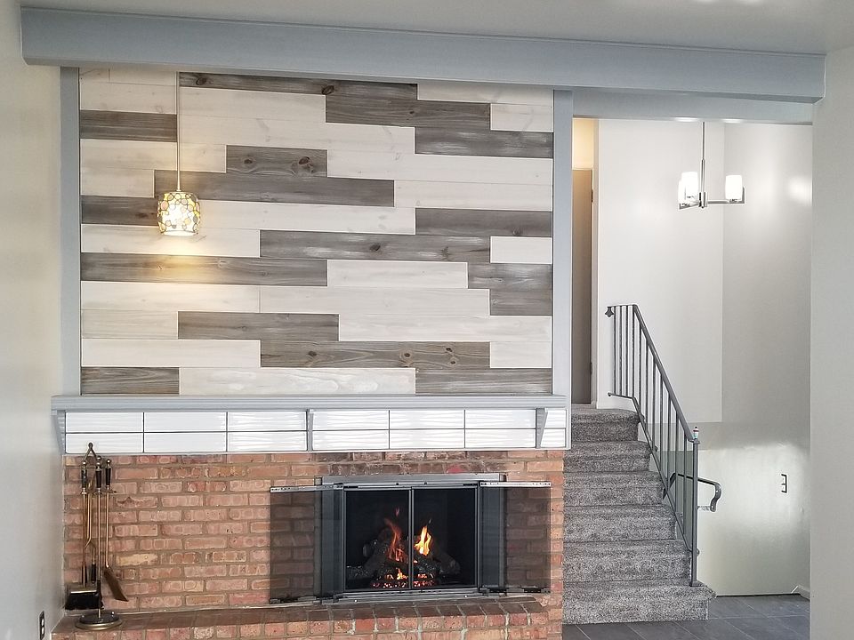 Main living area, staircase with chandelier.