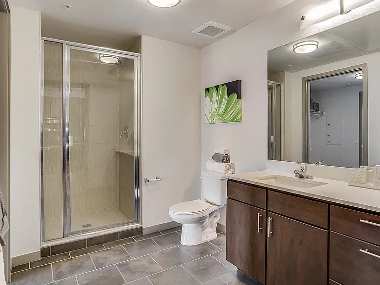 Tiled bathrooms featuring quartz countertops