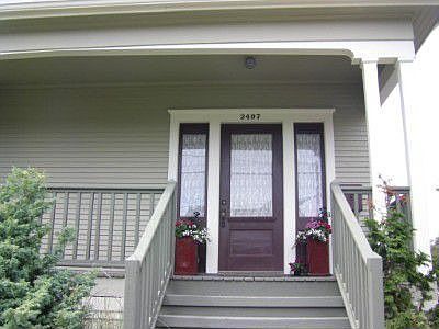Lovely front stairs and porch provide a warm welcome, as they have for over a century, to this caref