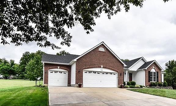 Custom built home with oversized 3 car garage with additional workshop space