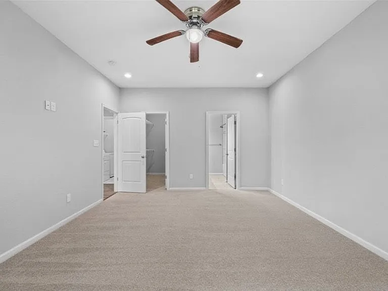 1st Floor Primary Bedroom with walk-in closet and Ensuite