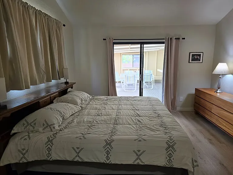 Master bedroom/Sliding glass door to patio.